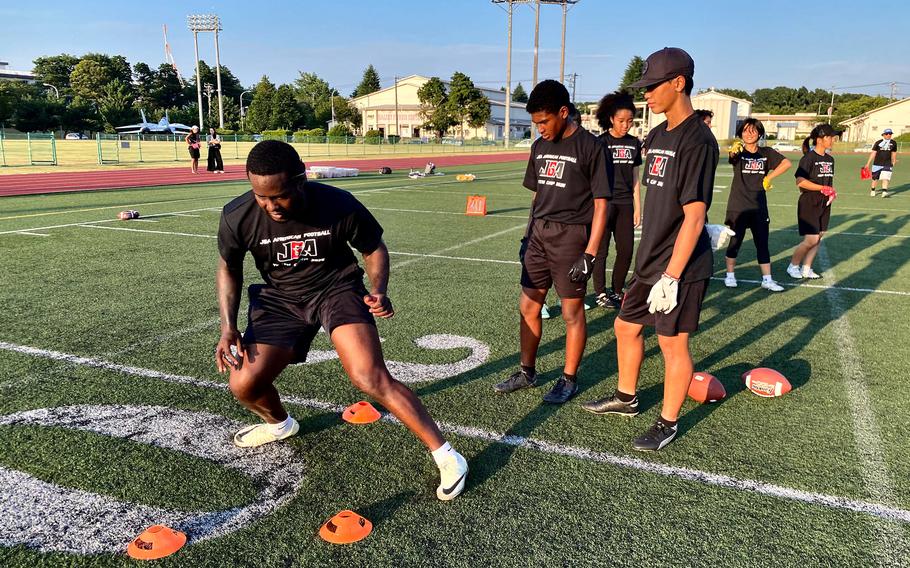 Student athletes participate in football drills during a Japan Gridiron Association (JGA) American football camp held onboard the installation.