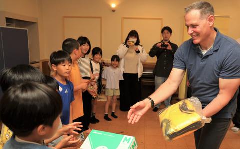 Photo Of Lt. Col. Damon Saxton, right, the U.S. Army Garrison Japan chaplain, hands out donated gifts to children at the Seiko Gakuen Children’s Home in Zama City, Japan, May 30, 2024. The gifts were mainly donated by religious followers from Camp Zama and Naval Air Facility Atsugi as part of an effort to support local youths in the community. 