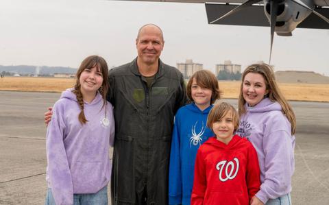 Photo Of U.S. Air Force Col. Brett Cochran, 374th Airlift Wing deputy commander, poses with his family.