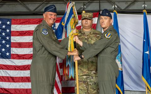 Photo Of U.S. Air Force Lt. Gen. Ricky N. Rupp, left, U.S. Forces Japan and 5th Air Force commander, passes a guidon to Col. Paul Davidson, right, 35th Fighter Wing incoming commander, during the 35th FW change of command ceremony at Misawa Air Base, Japan, July 8, 2024. The passing of the guidon marks the beginning of Davidson’s tour as the commander.