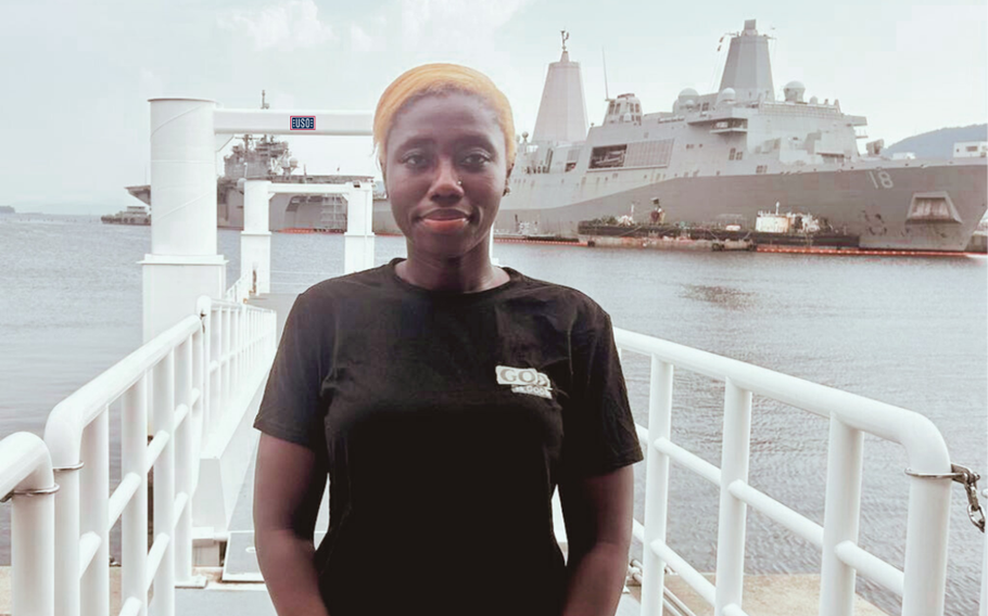 RS3 Adeosun, Tomiwa at Fleet Landing with USS Tripoli LHA-7 and USS New Orleans LPD-18 in the background.