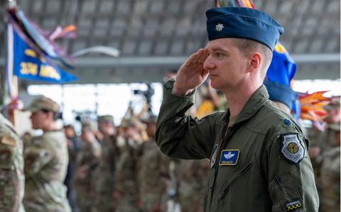 Photo Of U.S. Air Force Lt. Col. Christopher Casler, 374th Operations Group deputy commander, gives the first salute to Col. Richard McElhaney, 374th Airlift Wing incoming commander, during the 374th AW change of command ceremony at Yokota Air Base, Japan, July 9, 2024. The change of command ceremony formally transferred command of the 374th AW from Col. Andrew Roddan, 374th AW outgoing commander, to McElhaney.