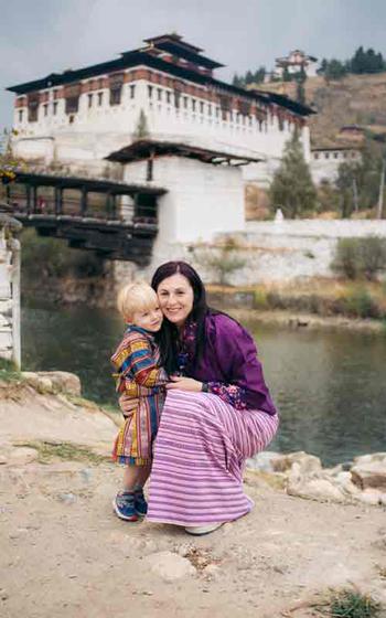 Author and son wearing traditional Bhutanese dress.