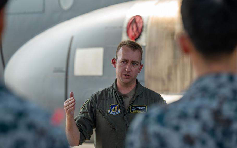 U.S. Air Force Capt. William Waller, 36th Airlift Squadron C-130J Super Hercules pilot, speaks to newly assigned members from the Japan Air Self-Defense Force Operations Support Wing and Air Intelligence Wing.