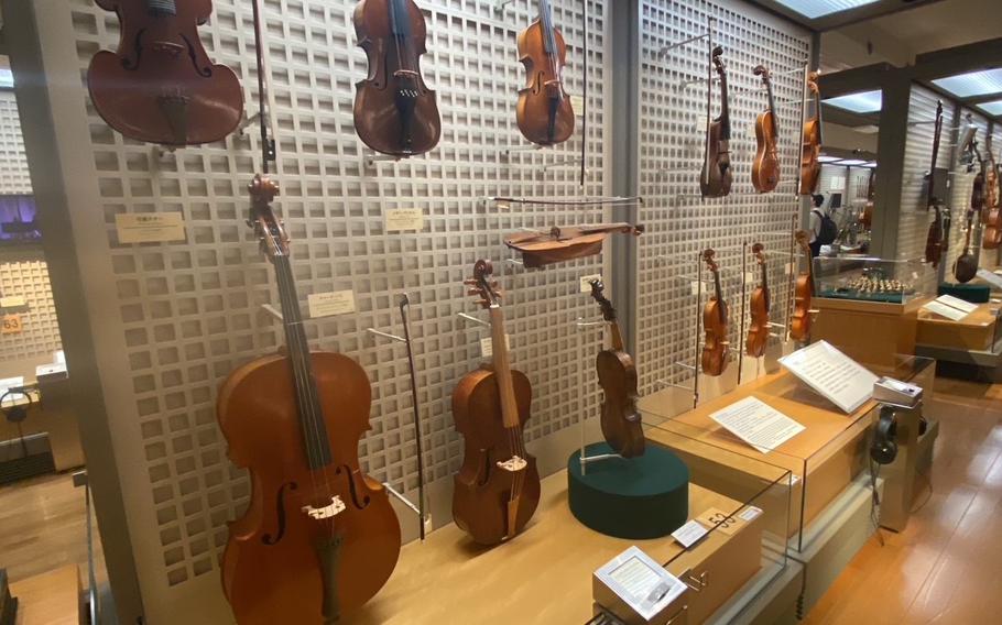 Stringed instruments are displayed.