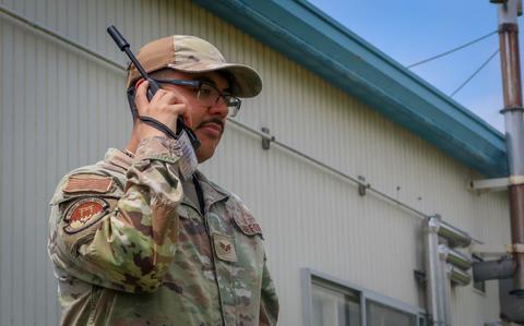 Photo Of U.S. Air Force Senior Airman Jospeh Blevins, 374th Communications Squadron cyber operations technician, uses a radio during exercise Samurai Relay II at the Combined Arms Training Center, Camp Fuji, May 21, 2025. The Samurai Relay series is a unit-level training event designed to evaluate the 374 CS ability to rapidly deploy teams to establish communications in austere environments with no existing infrastructure.