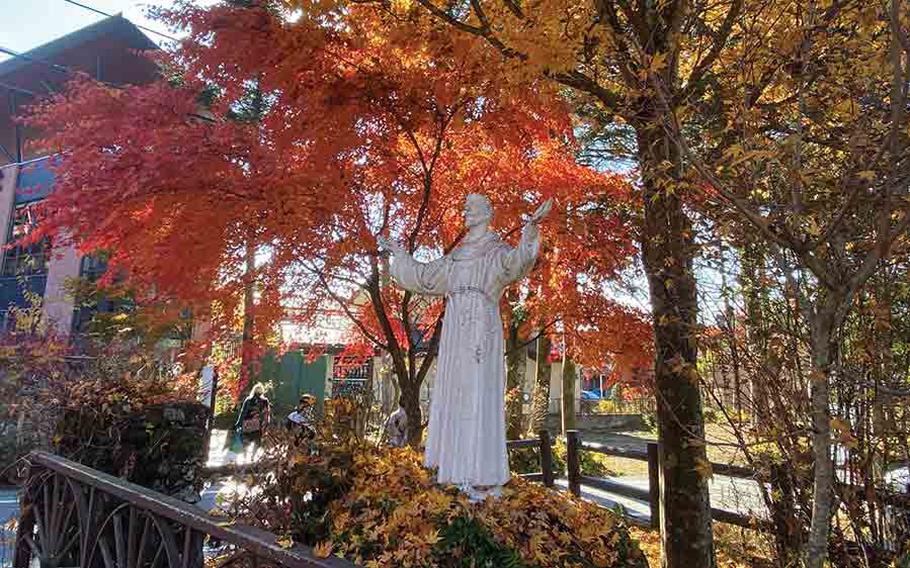 fall foliage and statue