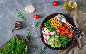 Salad of chickpeas, tomatoes, cucumbers, radish and greens. Dietary food. Vegan salad.