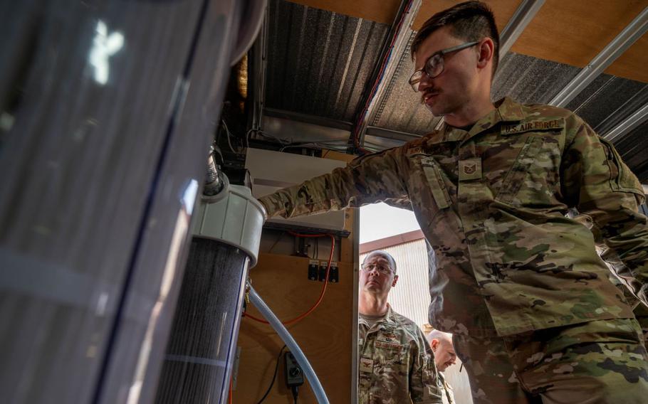 U.S. Air Force Tech. Sgt. Lucasz Krawczyk monitors a filtration system.