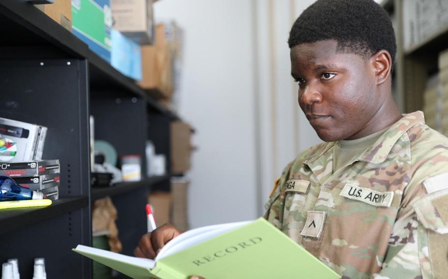 Pfc. Franck Karel Penga Nkweya conducts an inventory.