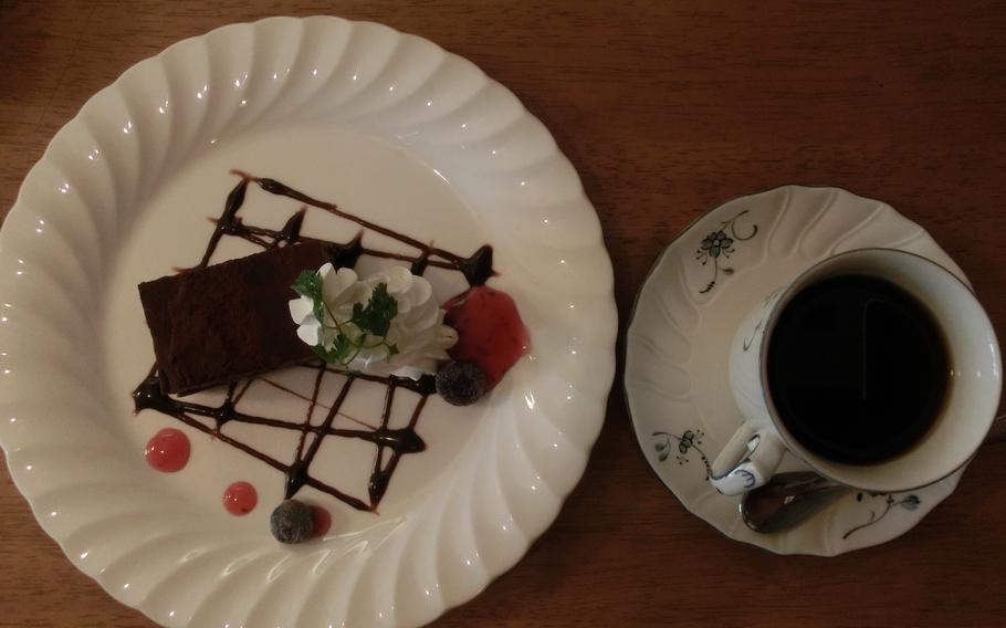 coffee and chocolate cake on the table.