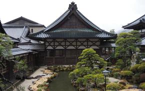 A pond can be seen in the garden of the temple. 