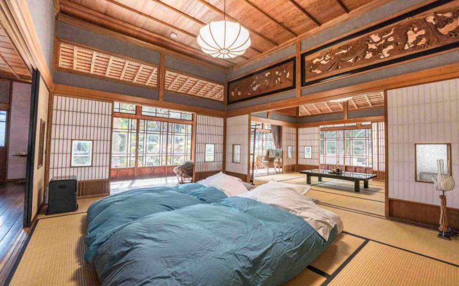 Two Japanese-style beds are on the floor of a room.