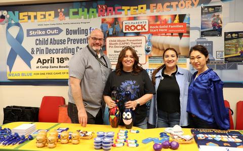 Photo Of Army Community Service staff pose for a photo at the Camp Zama Bowling Center.