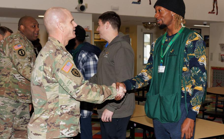 Lt. Gen. Omar Jones, left, commander of U.S. Army Installation Management Command, greets U.S. Army Garrison Japan employee Alex Jones on Jan. 29, 2024, during a two-day visit to Camp Zama, Japan. The commander, accompanied by IMCOM senior enlisted leader Command Sgt. Maj. Jason Copeland and Brenda Lee McCullough, director of IMCOM-Pacific, made the visit to show gratitude to the workforce.