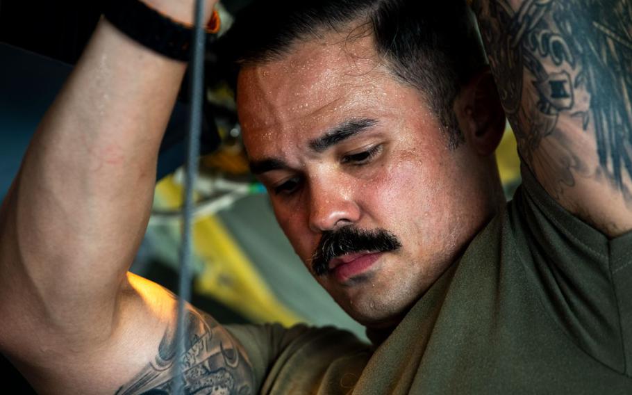 U.S. Air Force Maj. David Stuppy rigs a C-130J Super Hercules for a mass casualty exercise.