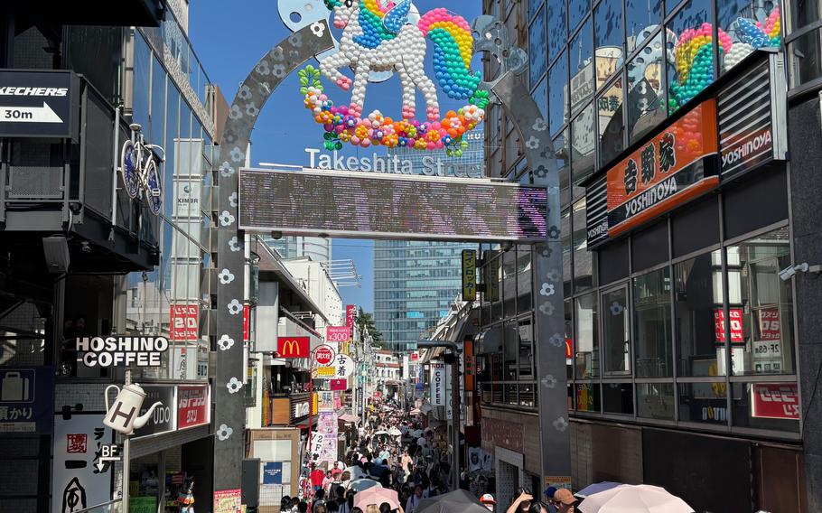 People are walking on Takeshita-dori Street.