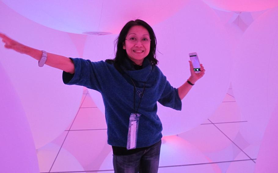 A woman enjoys one of the exhibitions at teamLab Planets.