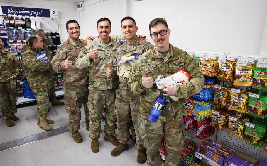 MIlitary personel pose for a photo.