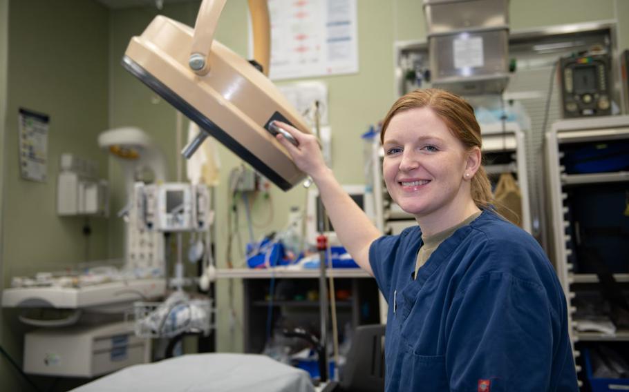 U.S. Air Force Capt. Hannah Snider, 374th Medical Group clinical nurse, poses for a photo in the urgent care clinic at Yokota Air Base, Japan, Feb. 27, 2025. The 374th HCOS supports warfighting readiness by providing critical medical services, including emergency care, surgical support, and preventive health measures, ensuring personnel are fit for duty and prepared for global contingencies. 