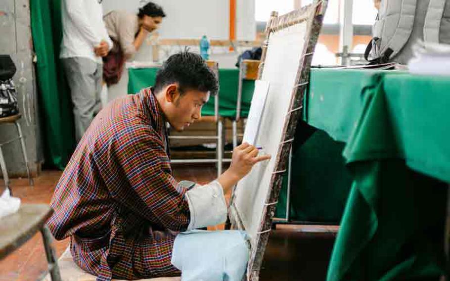 A student demonstrates his skill at the National Institute for Zorig Chusum.