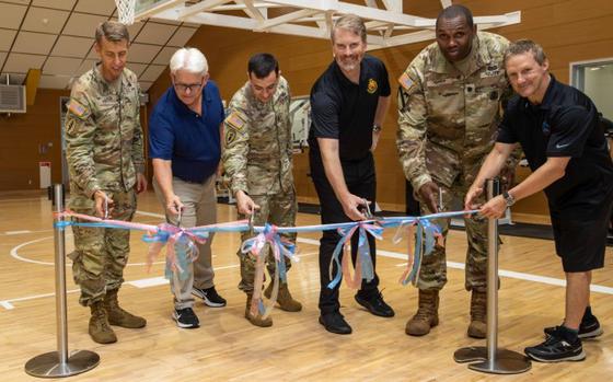 Photo Of Col. Marcus Hunter, left, commander of U.S. Army Garrison Japan, and others participate in a ribbon-cutting ceremony to officially reopen a fitness center at Sagami General Depot, Japan, Aug. 27, 2024. The center underwent several renovations as part of a two-year-plus project. 