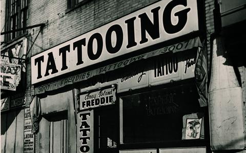 Photo Of front photo of a tattoo shop.