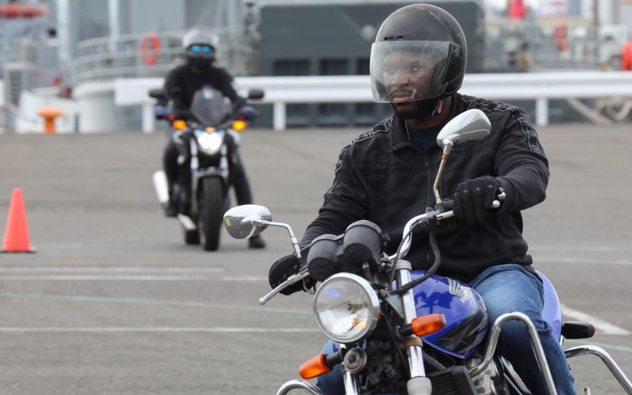 Sgt. Michael Barnes, assigned to the 78th Signal Battalion, practices a maneuver during the Basic Rider Course 1 at Yokohama North Dock, Japan, July 19, 2024. U.S. Army Garrison Japan recently restarted its motorcycle safety courses after a yearslong hiatus to train more riders.