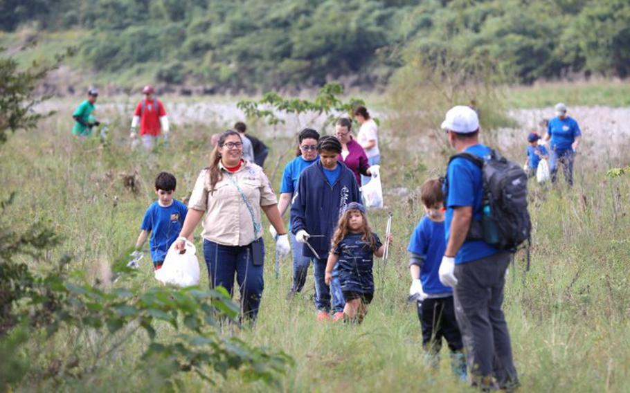 Members of Cub Scout Pack 34 participate in a community cleanup Oct. 27 at the Shindo Sports Ground near the Sagami River in Sagamihara City, Japan.