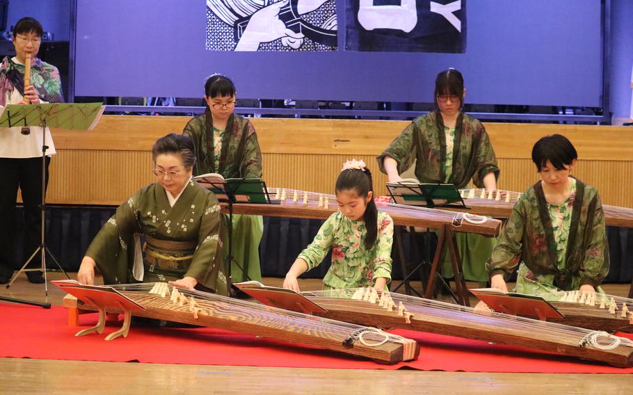 some people palying traditional instruments.