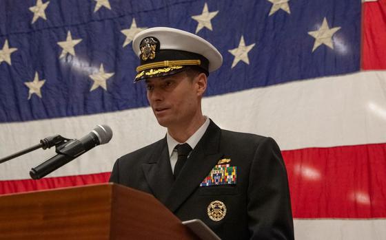 Photo Of Capt. Ethan M. Rule, incoming commanding officer of the forward-deployed USS America (LHA 6), speaks during his change of command ceremony.