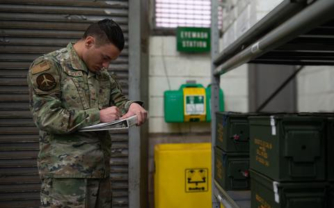 Photo Of Senior Airman James Gibbs-Gerckens reviews a checklist.