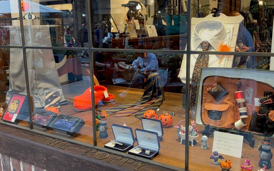 An outside of a general store selling ties and trousers.