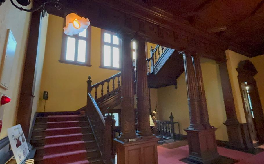 The interior of Western-style Victorian guest house. Stairs can be seen.
