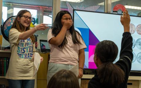 Photo Of two of the students are hosting an event.