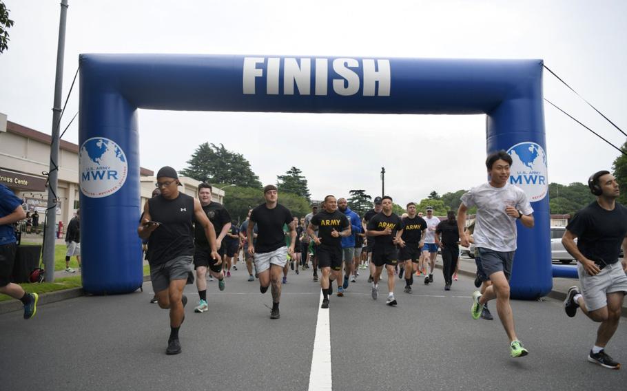 Runners take off from the start line of the Army Week 5K Fun Run held June 13 on Camp Zama, Japan. More than 50 youth and adult runners, including Soldiers, civilians, family members, Japanese employees and Japan Ground Self-Defense members, came out for the event. 