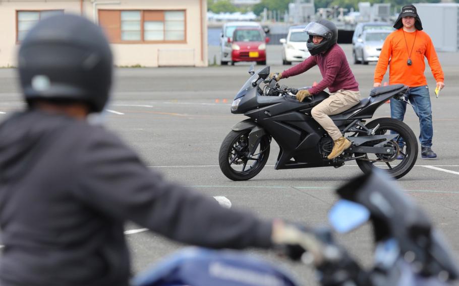 Spc. Jim Xiong, assigned to the 311th Military Intelligence Battalion, practices a maneuver during the Basic Rider Course 1 at Yokohama North Dock, Japan, July 19, 2024. U.S. Army Garrison Japan recently restarted its motorcycle safety courses after a yearslong hiatus to train more riders.