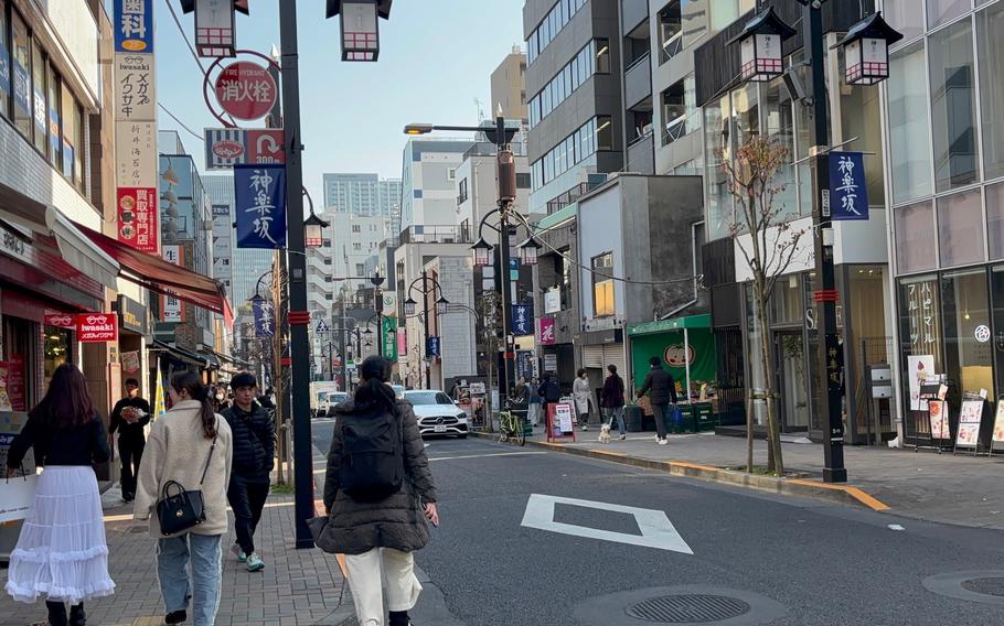 People walk in the street.