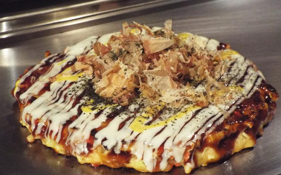 Delicious okonomiyaki ready to eat in Japanese restaurant.