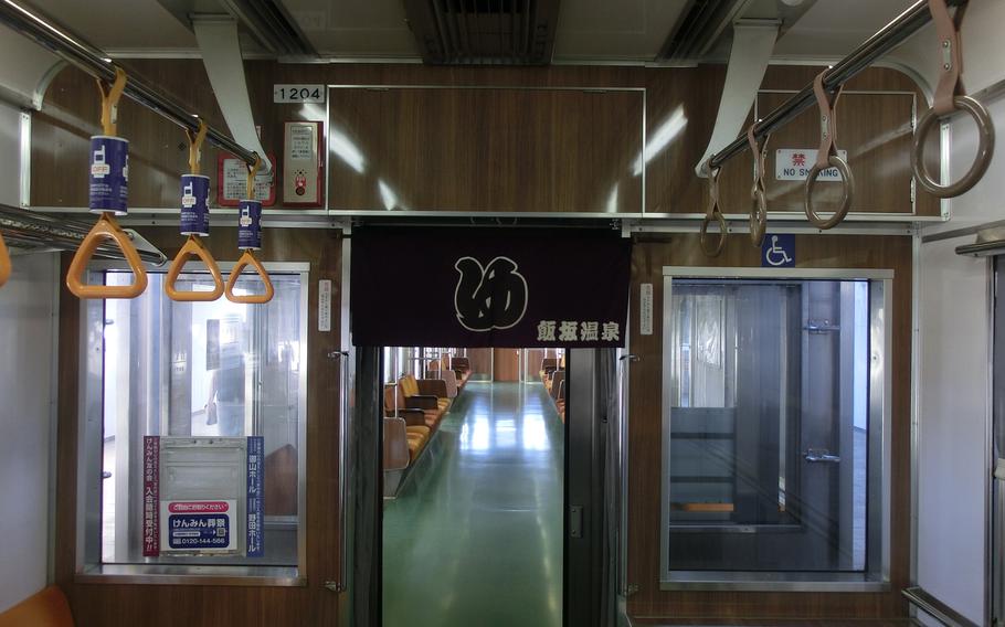 the train cars are split with short curtains.