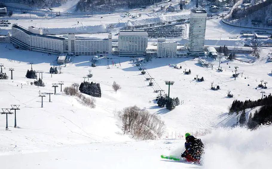 A skier is enjoying themselves at Naeba Ski Resort.