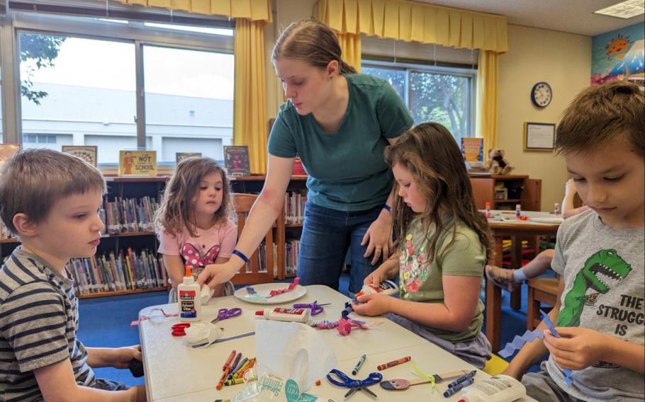 Maribel Sikes, center, prepares a craft class in September 2023 at the Camp Zama Library during the “Story Time” event she holds regularly there for preschoolers. This month, Maribel made it as a finalist in 2024’s Operation Homefront Military Child of the Year Award.