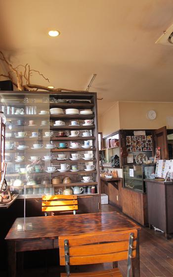 inside the cafe, a table with two chairs can be seen.