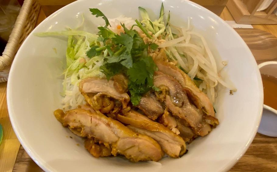A pho dish is on the table.