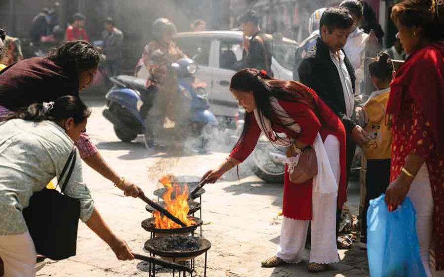 Making an Offering in Kathmandu Square