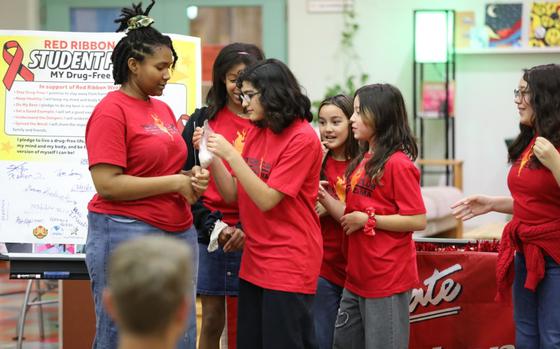 Photo Of Members of the Torch Club, a Boys and Girls Clubs of America initiative aimed at helping nurture and develop teen leadership skills, perform a skit Nov. 1.