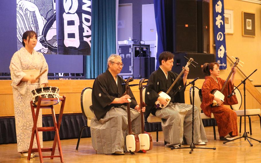 some people palying traditional instruments.