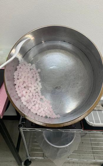 Konpeito is being made in a pot.