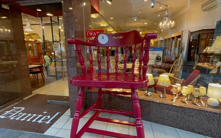 A chair is placed in front of a shop in Motomachi, Yokohama City.