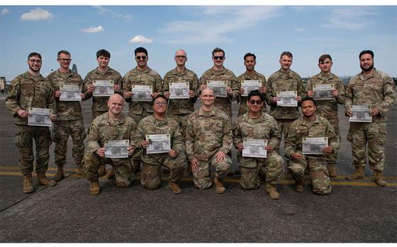 U.S. Air Force Airmen assigned to the 374th Aircraft Maintenance Squadron pose for a photo after a dedicated crew chief ceremony at Yokota Air Base, Japan, May 28, 2025. The DCC ceremony is a long-standing tradition, designed to instill a deeper sense of aircraft ownership and mission commitment. Dedicated crew chiefs are often the first and last set of eyes on an aircraft before and after missions, ensuring peak performance and safety.